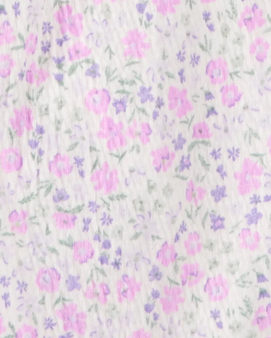 Outra vista de Macacão bebê manga curta floral com faixa rosa